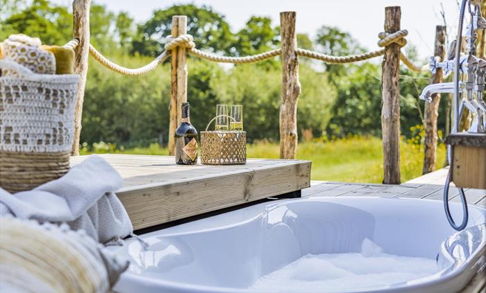 Relax in style in the Cabins outdoor sunken bath - Luxury Glamping Cabin Carmarthenshire, West Wales